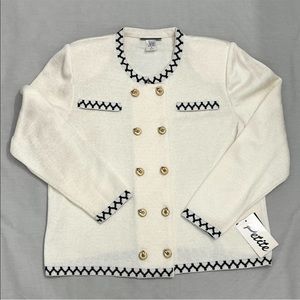 Vintage long sleeve cardigan with shoulder
pads.